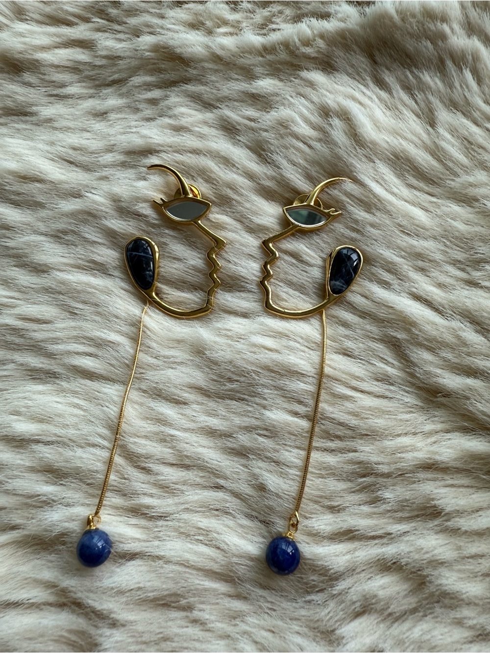 Gold Face Outline Drop Earrings with Blue Stones